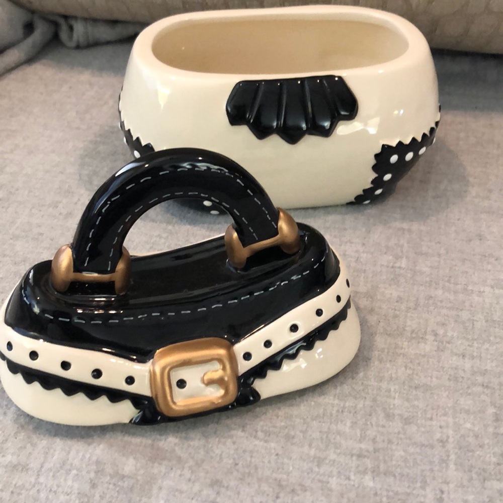 Purse shaped ceramic jar.